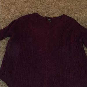 Three quarter length sleeve knit sweater.